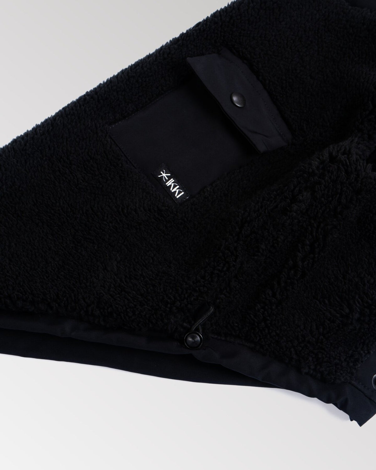 Bianca Vest in All-Black, close-up detail