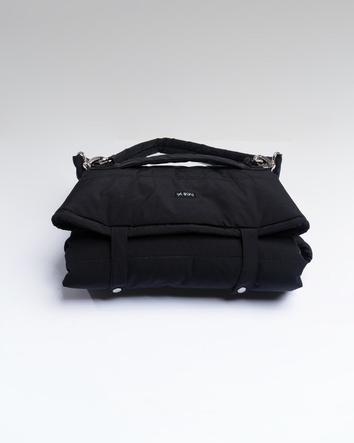 Ole Mat in All-Black, folded with carry strap